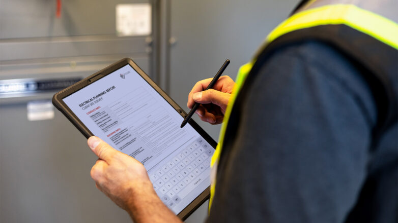 A Houle electrician working on electrical planning report